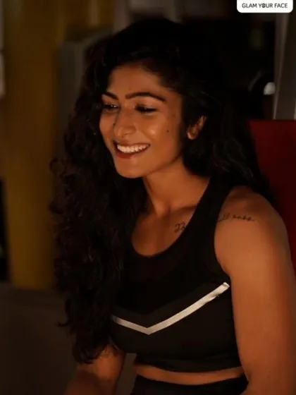 A candid, happy shot from the fitness shoot. Her skin looks glowing and healthy, demonstrating that "no-makeup" makeup look that is perfect for lifestyle and fitness branding.