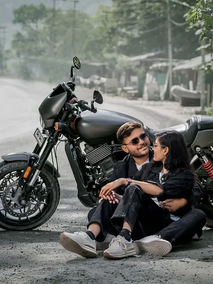 For the couple with a bit of an edge. Posing with a Harley on a mountain road, this shot is all about cool, adventurous vibes. Perfect for telling a different kind of love story.
