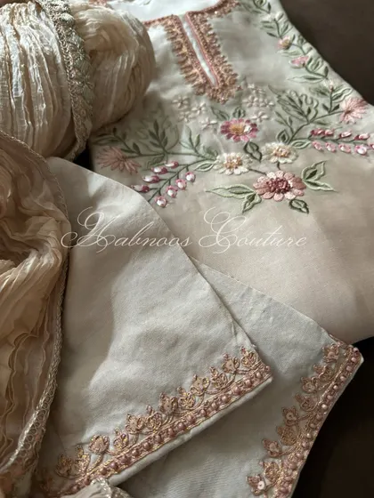 A detail shot of the silk chanderi suit, showing the embroidered lower and the crushed silk dupatta.