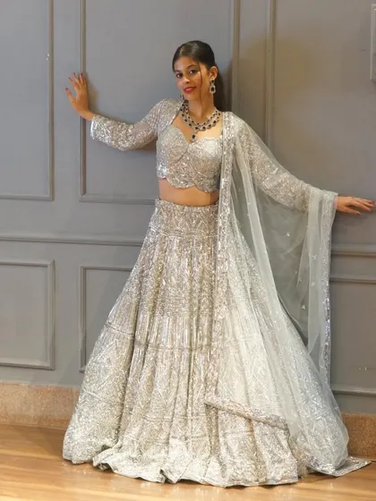 Another look at our stunning all-over silver sequin lehenga. This piece is high-quality, fits beautifully, and guarantees you will look and feel amazing at your reception or sangeet.