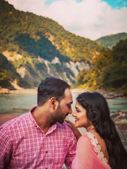 Another beautiful close-up from a Rishikesh pre-wedding shoot, focusing on the couple's expressions against the mountain scenery.