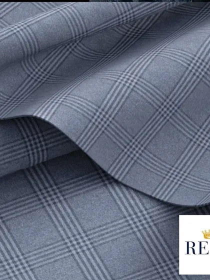 A classic Glen check fabric from Reda, an Italian mill with a legacy of quality since 1865. This fabric is perfect for creating a business suit or blazer that is both timeless and sophisticated.