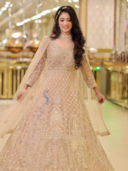 Another full-length shot of the bride twirling, her Anarkali and smile making for a perfect picture.
