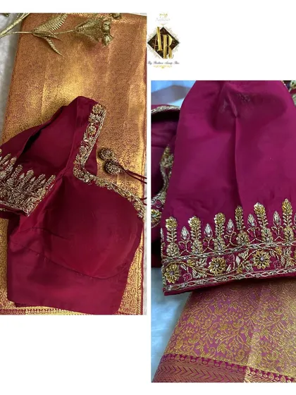 A classic maroon blouse with a simple, elegant border of zardosi work on the sleeves. This is a versatile piece that can be paired with many different sarees.