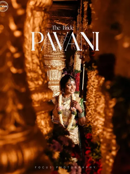 A beautifully captured moment of the bride, Pavani. The warm lighting enhances the golden tones in her jewelry and the glow of her makeup.