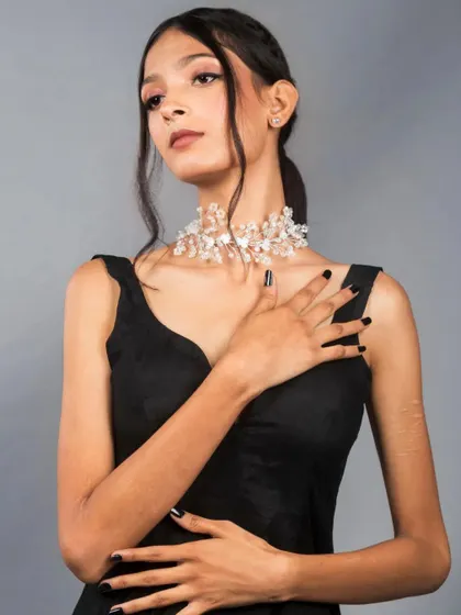 A slightly different angle from the same series, showing versatility in posing. The model's gaze away from the camera creates a candid, thoughtful mood.