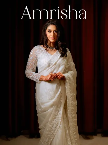 A classic portrait of Amrisha. Her reception look is one of delicate sophistication and radiant glow.