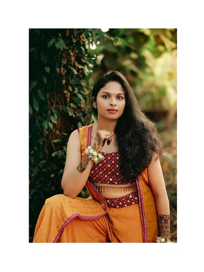 A confident and stylish portrait of the bride at her Haldi ceremony.