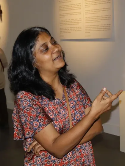 The joy of experiencing art firsthand. An attendee engages with a sculpture at our residency showcase, demonstrating the interactive and thought provoking nature of the work created here.