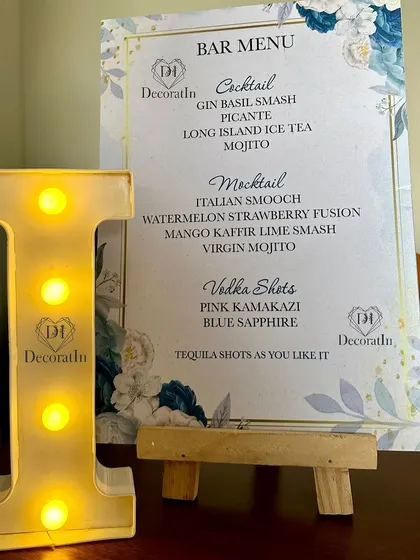 A close-up of the custom bar menu, with a small marquee 'I' for the birthday boy, Ishaan.