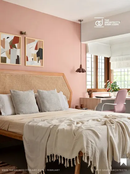 A featured image of the peach-toned guest bedroom, showcasing the rattan headboard and cozy study nook by the window, creating a warm and personal space.
