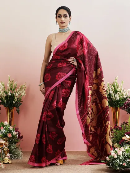 The full, flowing silhouette of the maroon floral saree, a perfect blend of tradition and modernity.