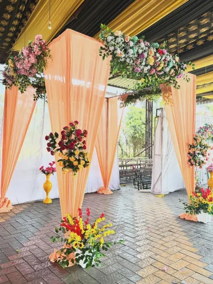A different perspective of the peach-themed decor, showing how the draped archway can serve as a beautiful entrance or photo spot.