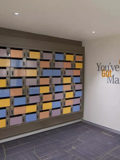 A playful and colorful mailroom at CorporatEdge Horizon in Gurugram. The design turns a purely functional area into a vibrant and engaging space, reflecting the energetic culture of the co-working environment.