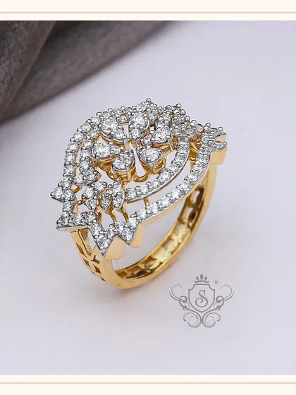 A magnificent diamond statement ring with a floral or peacock-inspired design. The intricate setting of numerous small diamonds creates a dazzling effect, making this a centerpiece of any fine jewellery collection.