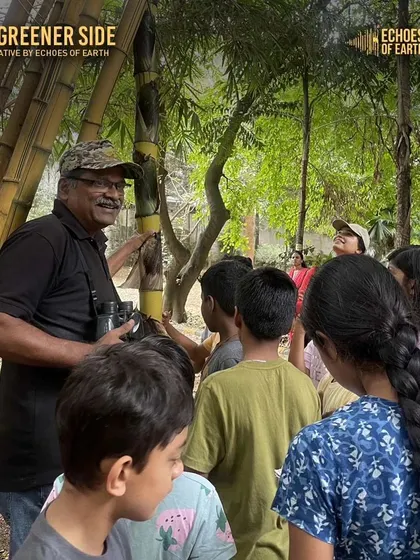 Our naturalist Arun teaching a group of kids about bamboo during a journaling walk. Expert guidance enriches the learning experience.