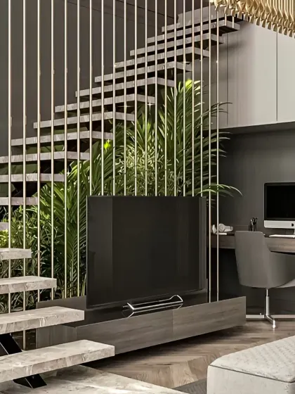 This design cleverly integrates a home office and TV area under a modern staircase. The vertical metal rods act as a stylish partition while maintaining an open and spacious feel.