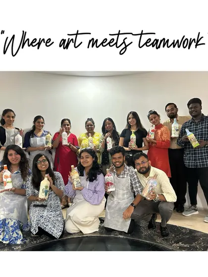 "Where art meets teamwork." This group did an amazing job transforming simple bottles into decorative pieces for their office.