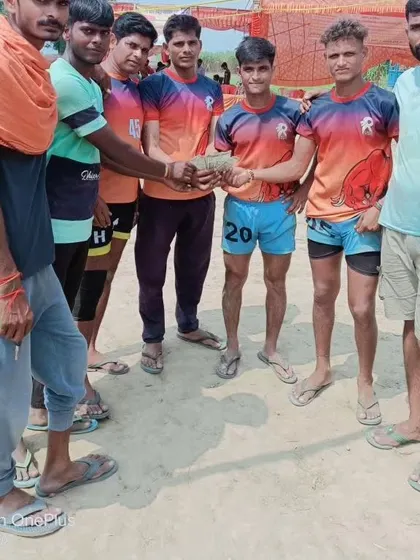 Players sharing their prize money, a reward for their hard-fought victory.
