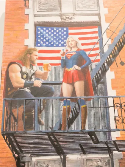 A glimpse of Thor and Superwoman sharing a drink on a balcony in "Ordinary Powers," a crossover moment of divine relaxation.