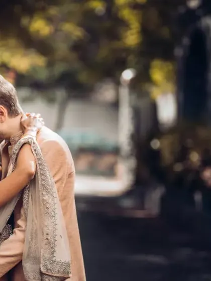 An intimate moment between a multicultural couple, showcasing love that transcends borders.