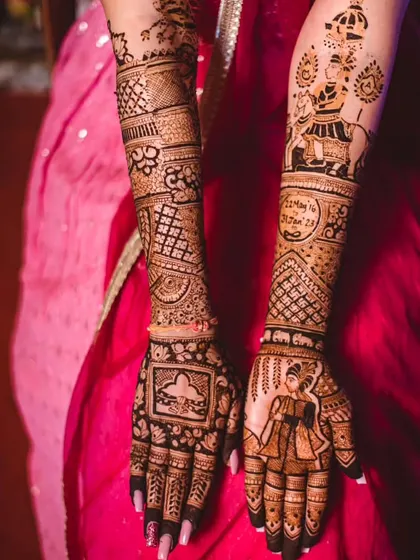 This bridal design tells a story with a 'baraat' scene on one arm and a bride figure on the other palm. It's a perfect example of combining narrative elements with traditional patterns.
