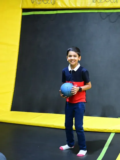 Our trampoline park isn't just for jumping; it's also great for a game of dodgeball. This guest is ready to play.