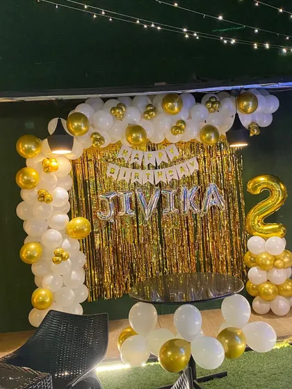 Another angle of the elegant white and gold second birthday decoration.