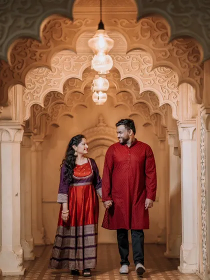 A romantic walk through a grand corridor with stunning architectural details, perfect for a royal-themed pre-wedding shoot.