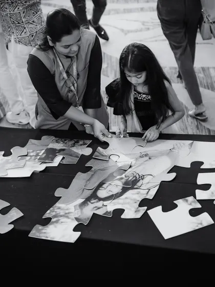A custom jigsaw puzzle of the couple's photo for guests to assemble. We love incorporating fun, interactive elements that bring guests together and create lasting memories.