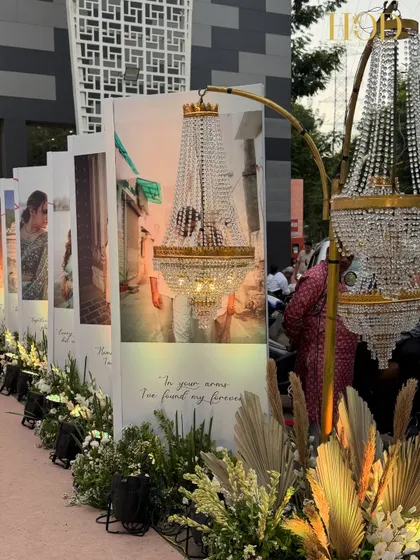 A closer look at the personalized photo wall lining the entrance. Each panel tells a part of the couple's story, creating an engaging and emotional journey for guests as they arrive.