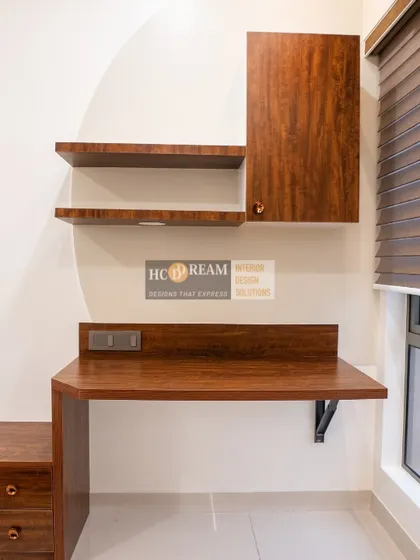 A compact and functional study desk from our Merline Pristine project in Kolkata. The dark wood finish adds a touch of classic elegance.