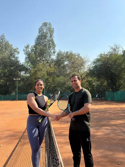 Sportsmanship is at the heart of our community. A friendly handshake at the net after a competitive match during our Amateur Tournament.