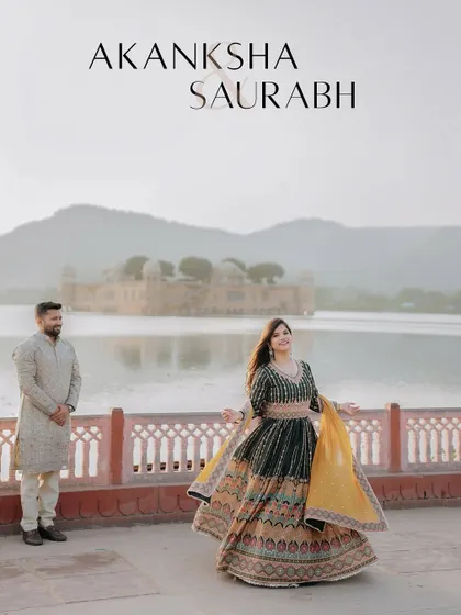 A beautiful twirl against the backdrop of Jal Mahal. The bride's lehenga and the stunning scenery come together to create a photo that is full of life, color, and celebration.