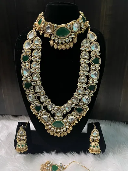 The full view of the green Kundan set, including the beautiful jhumka earrings. It's a complete, ready-to-wear rental solution for your big day.