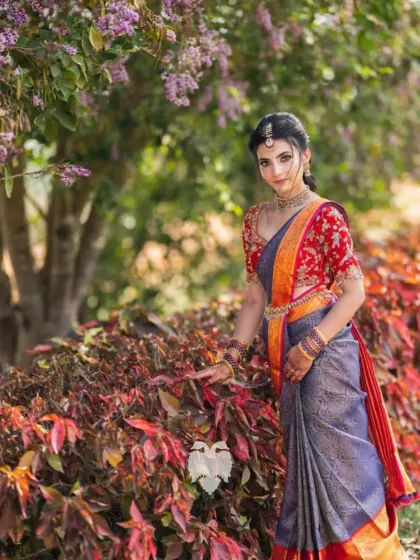 Jahnavi looking stunning in her red velvet blouse, a perfect blend of tradition and intricate artistry.