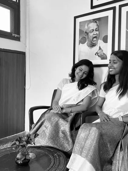 Another candid moment from our retro-themed saree photoshoot. Just two musicians sharing a laugh and celebrating classic style.