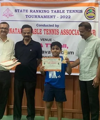 Shriram holding his silver medal trophy for the U-11 boys category.
