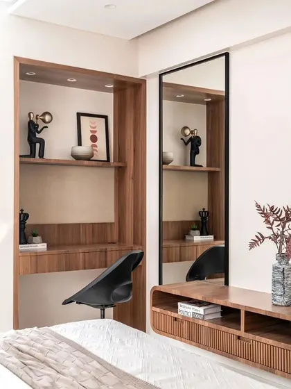 A compact study nook is cleverly integrated into the bedroom, providing a functional workspace without compromising on style.