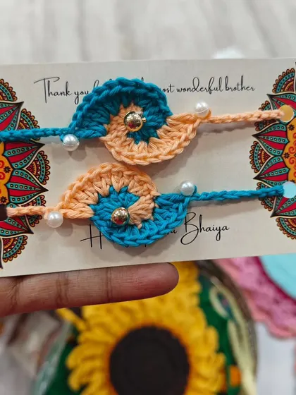 This peach and blue crochet rakhi design is one of my favorites. It is modern, vibrant, and a unique choice for Raksha Bandhan.