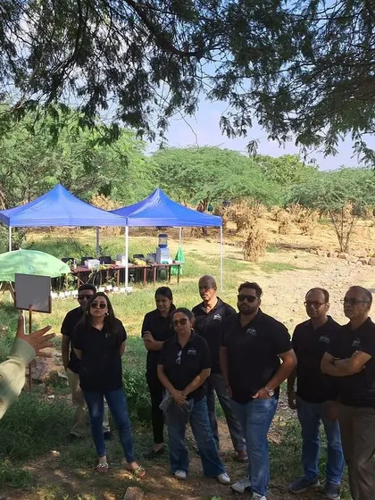 Our team member briefs the Bacardi volunteers before they begin their work, outlining the day's goals for restoring the Aravali Nagar Van.