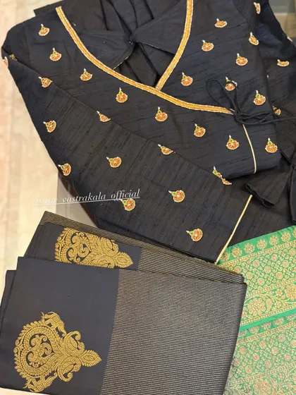 A black angrakha-style blouse with gold butis.