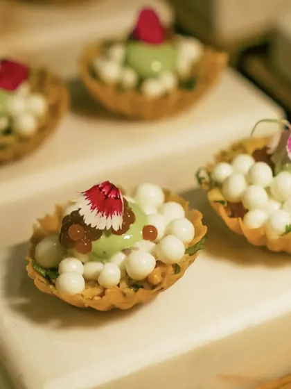 My modern take on Surti Chaat, served as an amuse-bouche. It features crisp shells, dahi pearls, and tamarind caviar.