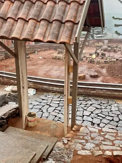 A duplicate image of the gate and pathway construction at TARA resort.