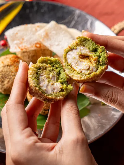 A cross-section of a cheese and corn croquette from Gallops. This detailed shot reveals the delicious filling, giving customers a tempting preview of the dish's texture and ingredients.
