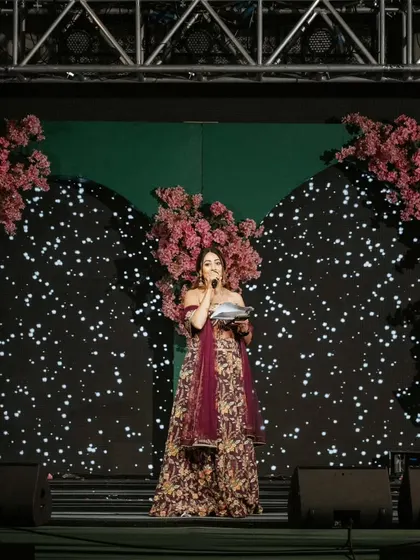 A powerful shot from a beautiful wedding I hosted in Udaipur. Standing on a grand stage, I make sure every announcement and performance is delivered with charisma, making the Sangeet night a spectacular show.
