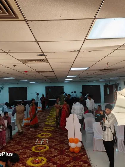 A naming ceremony in progress. I ensure the decor, like the floral rangoli on the aisle, adds to the traditional and auspicious feel of the event.