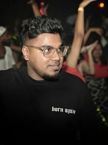 A candid moment captured mid-set. I'm always watching the crowd, seeing what they respond to, and planning my next move.