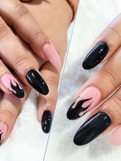 For those who like it bold, this design features edgy black flame art hand-painted over a soft pink base on long, almond-shaped nails.
