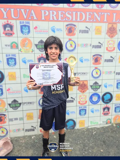 A U11 player receives an individual award for his performance in the Yuva President League.